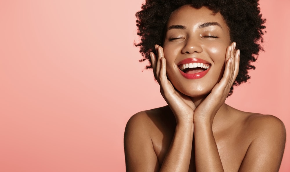 Beautiful African American woman feels comfortable in her skin thanks to cosmetic microchanneling treatment in Washington DC.
